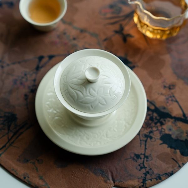 Mysterious gifts Ding Kiln Magnolia Pattern Ceramic Tea Cup with Saucer