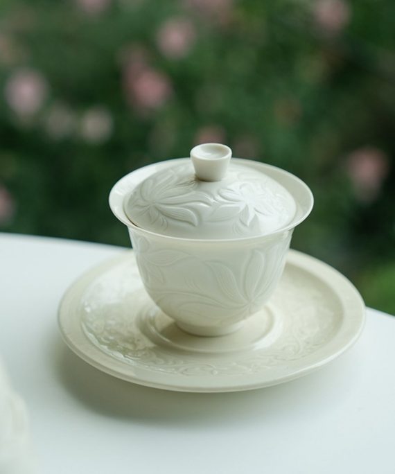 Mysterious gifts Ding Kiln Magnolia Pattern Ceramic Tea Cup with Saucer
