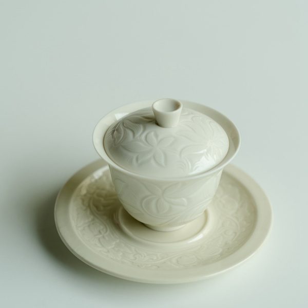 Mysterious gifts Ding Kiln Magnolia Pattern Ceramic Tea Cup with Saucer